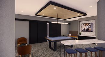 A pool table with a chair and a painting in the background.